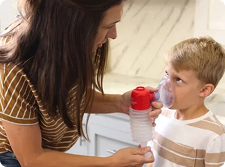 A baby eating food in a highchair